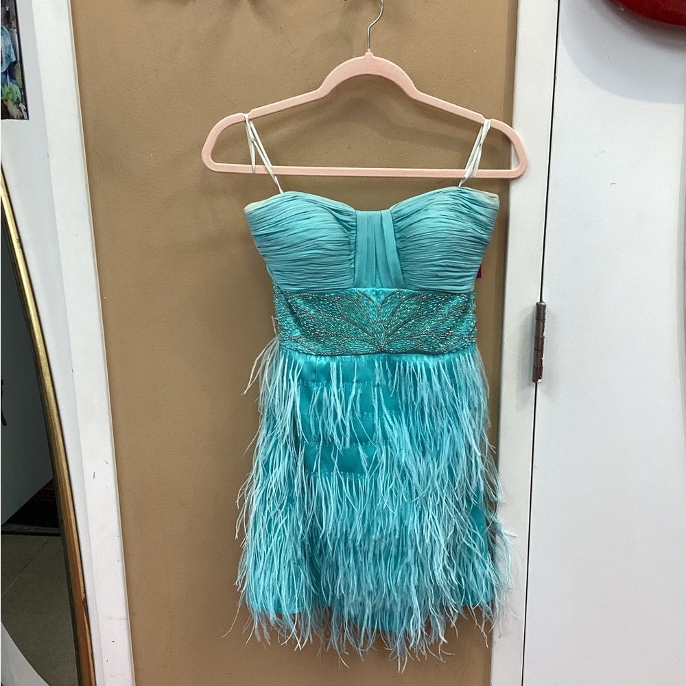 Light turquoise Blue Dresss with Detail Waistline and Feathers on Skirt